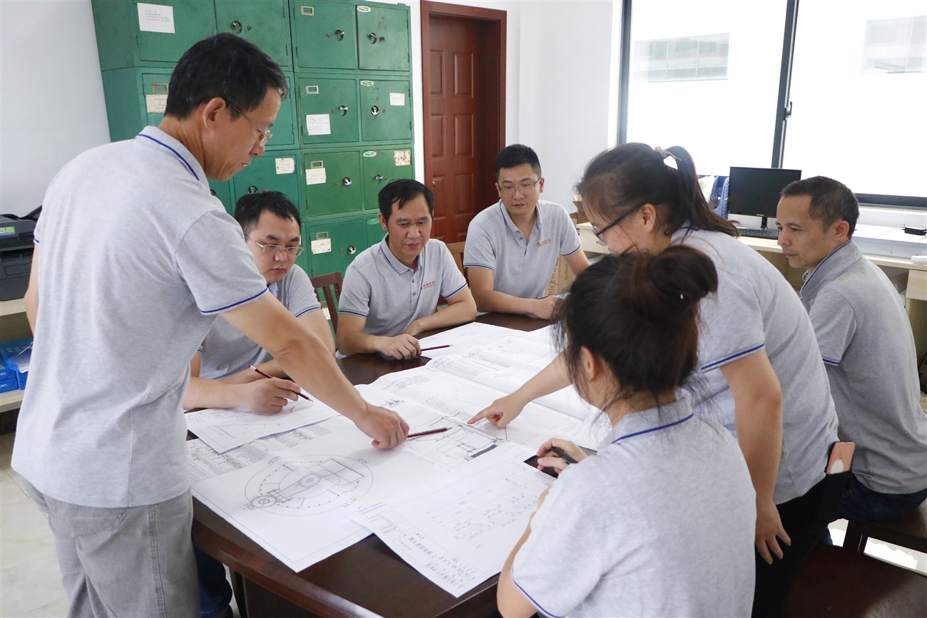 Cronus engineering team discussing mining machinery